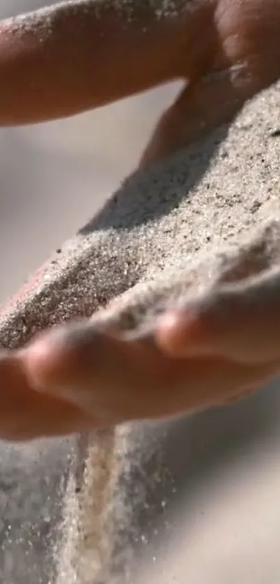 A serene flow of sand through fingers, capturing tranquility.