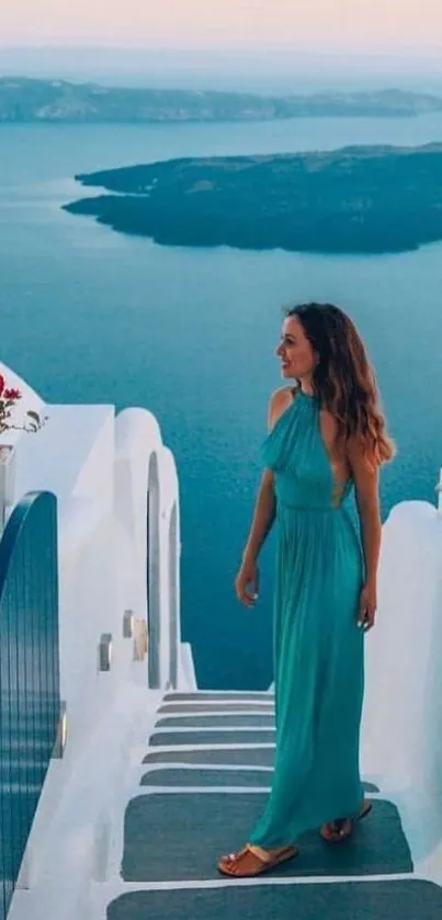 Woman in blue dress overlooking Santorini sea.