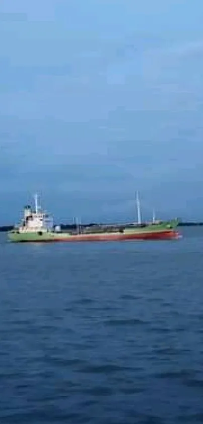 A serene ship sails on calm blue waters under a clear sky.