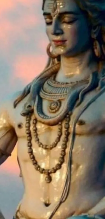 Serene statue of Shiva against sunset.