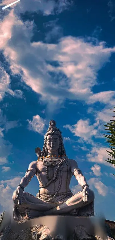Shiva statue with serene sky background, perfect for mobile wallpaper.