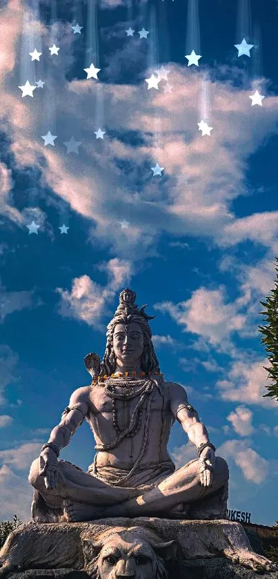 Statue of Lord Shiva under a vivid blue sky with clouds and greenery.