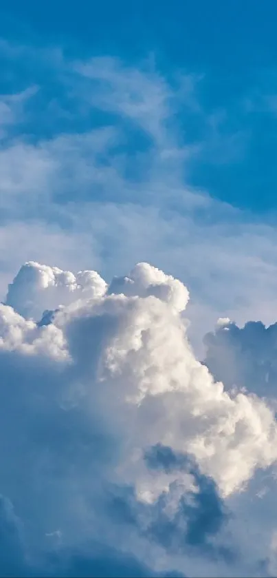 Tranquil mobile wallpaper of clouds in a blue sky.