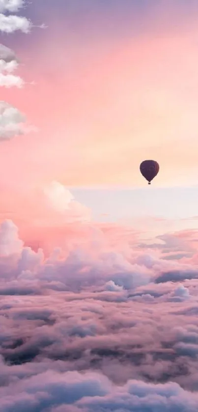 Mobile wallpaper with hot air balloon over pink clouds at sunset.