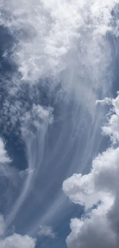 Serene sky with wispy clouds and a deep blue background.