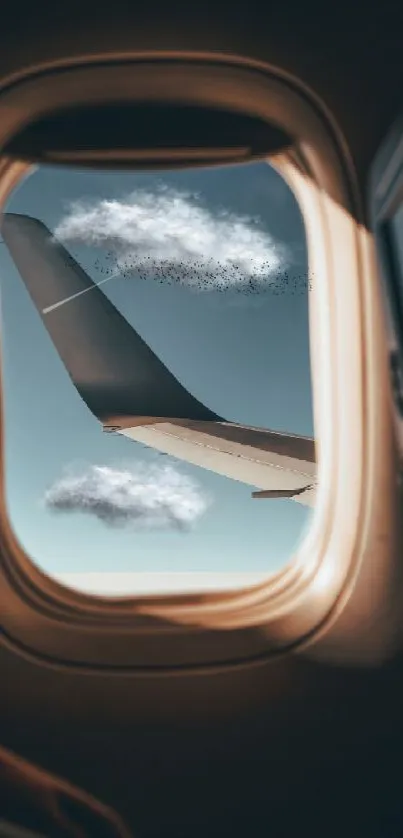 Airplane wing view through window with clouds in the sky.