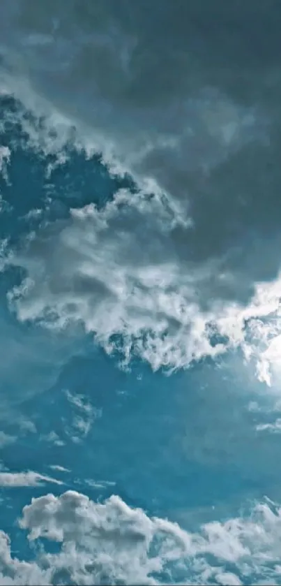 Blue sky with fluffy white clouds and bright sunshine.