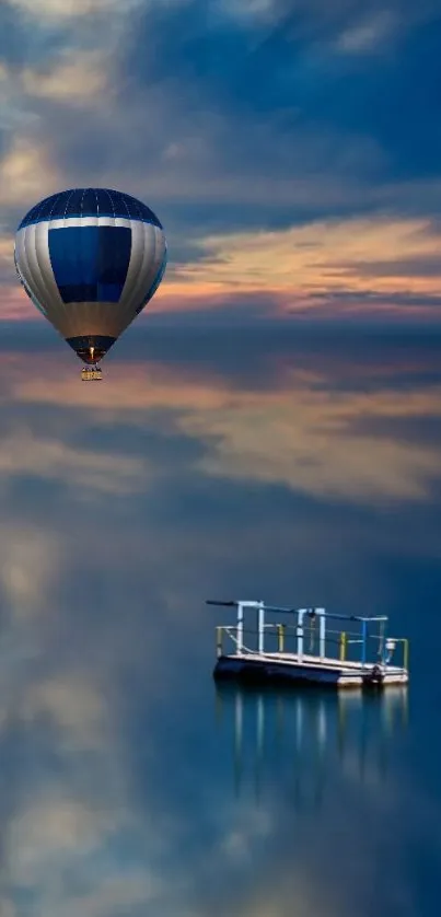 Hot air balloon over tranquil sea at sunset.