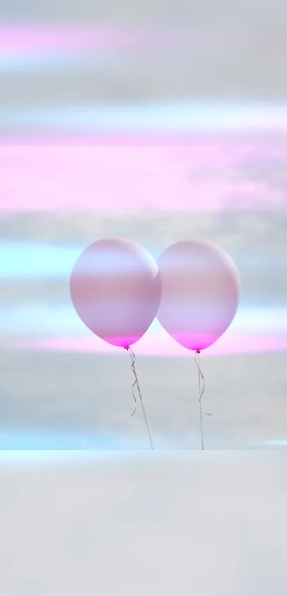 Two pink balloons floating against a pastel sky.