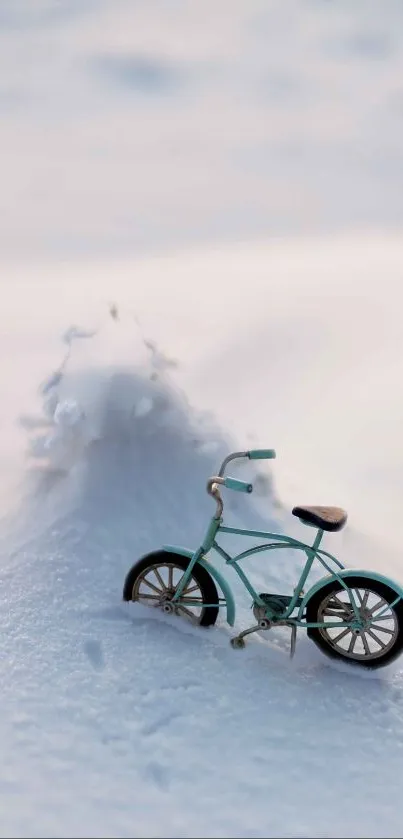Miniature bicycle in snow, serene winter wallpaper scene.