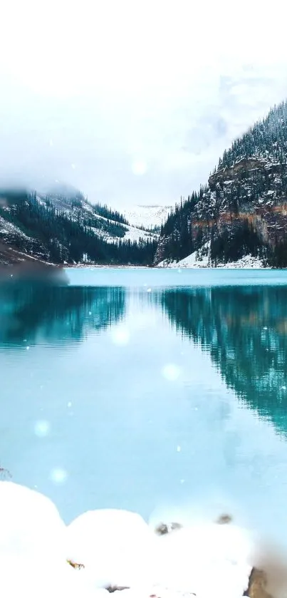 Peaceful snow-covered mountain reflected in a turquoise lake under a cloudy sky.