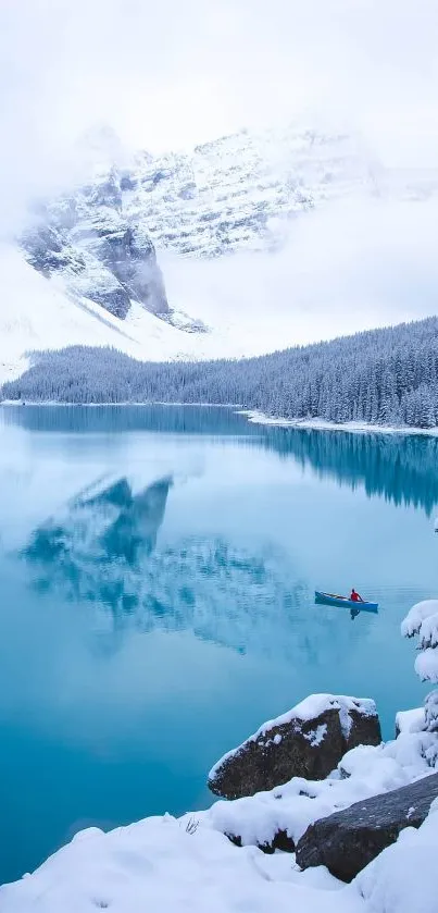 Snowy lake and mountains with a small boat.