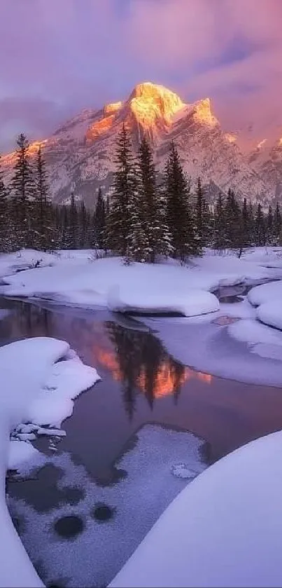 Serene snowy mountain sunset with pink skies reflected in a tranquil river.