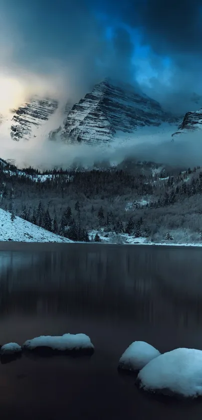 Serene snowy mountain with mist and a reflective lake.