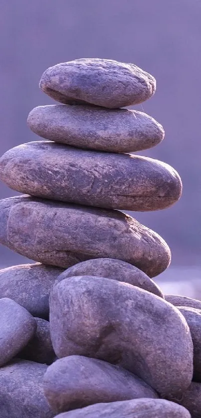 Purple stacked stones on a calming background wallpaper.