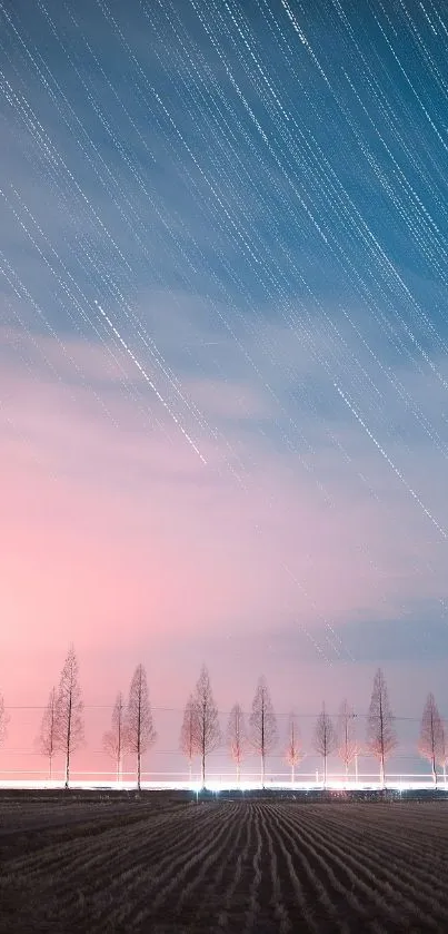 Starry night sky with silhouettes of trees against a pastel pink background.