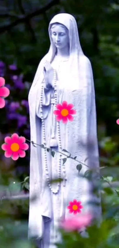 Serene statue surrounded by pink flowers in a lush garden setting.