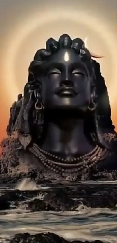 Stone Shiva statue with halo at sunset.