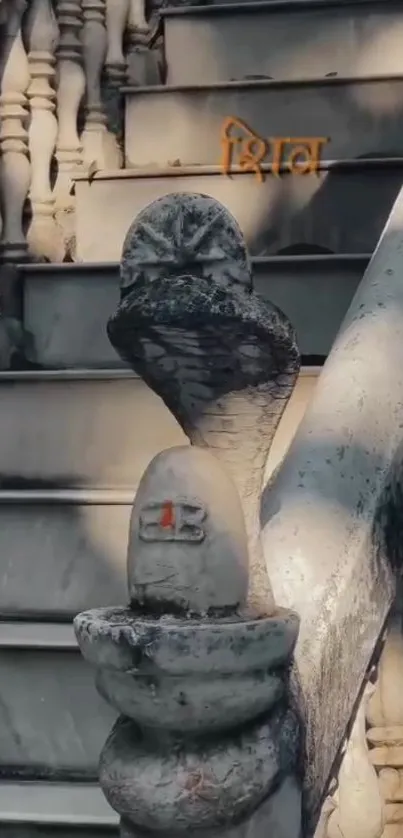 Stone stairs with a snake idol in tranquil setting.