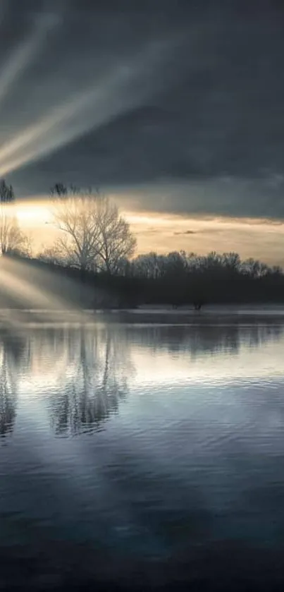 Serene sunrise over a tranquil lake with reflecting rays.