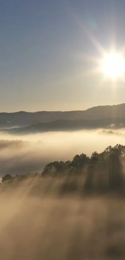 Sunrise over misty hills with bright sunlight and fog.