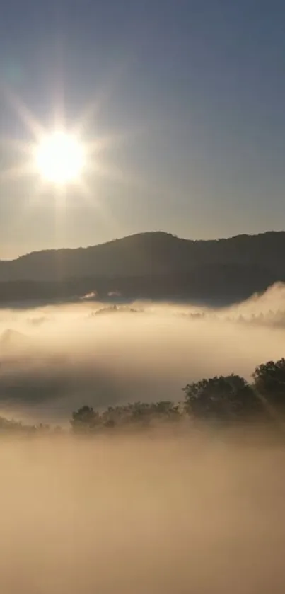 Beautiful sunrise over misty mountains with clear blue sky.