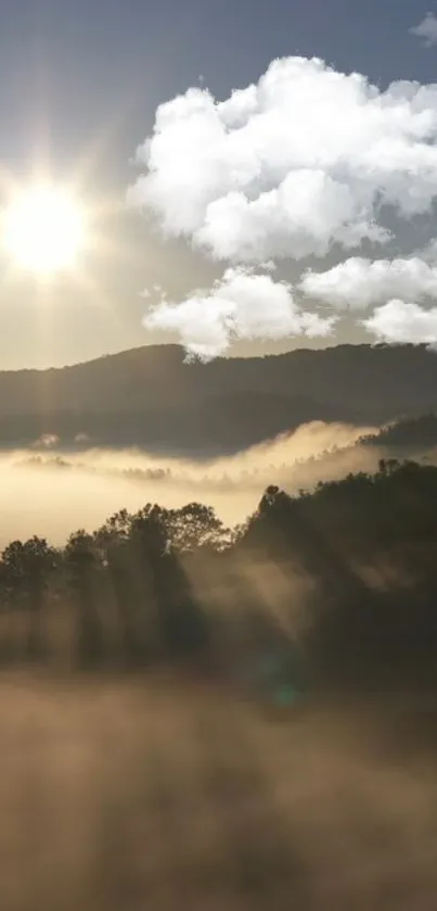 Golden sunrise over misty mountains with clouds and light rays.