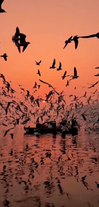 Serene sunset with birds flying over calm waters.