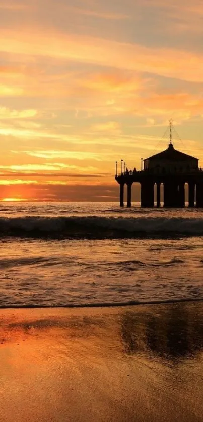 Serene sunset over beach with orange sky and calming waves.