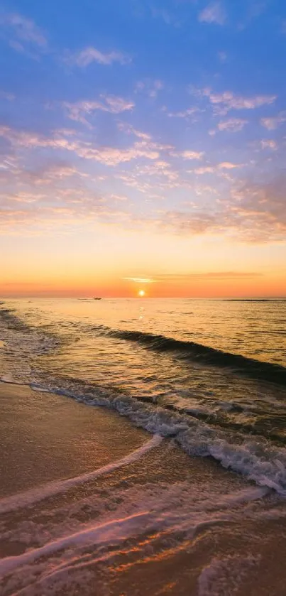 Serene sunset at the beach with gentle ocean waves.