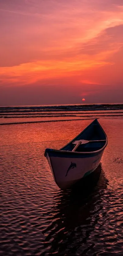 Serene sunset scene on beach with a solitary boat and vibrant orange sky.