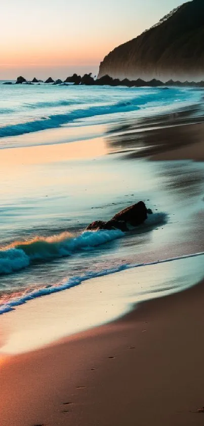 A serene sunset beach with gentle waves and a colorful orange sky.
