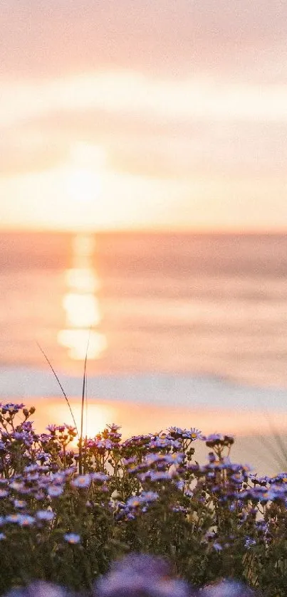 Serene beach sunset with purple wildflowers and ocean waves.