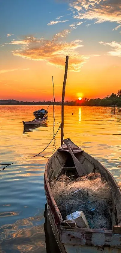 Wooden boat on calm water at sunset with orange sky.