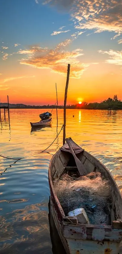 Sunset view with boats on a calm lake, reflecting vibrant orange hues.