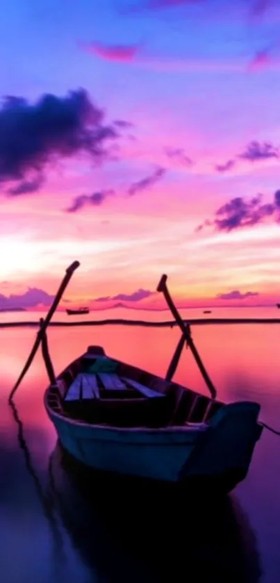 Serene boat at sunset with vibrant sky.