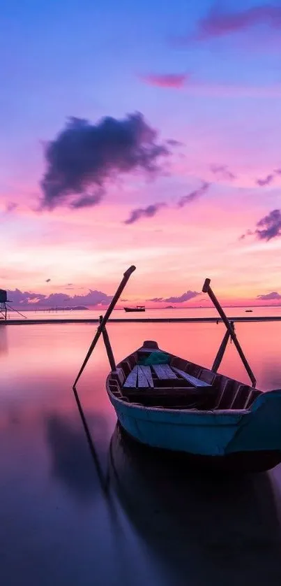 Tranquil boat on pink sunset sea with calm waters.