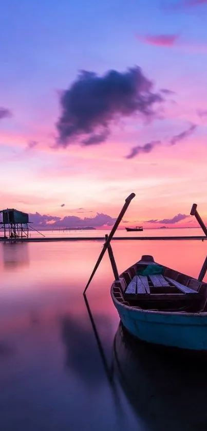 Tranquil sunset with a boat and pink sky reflection on calm waters.