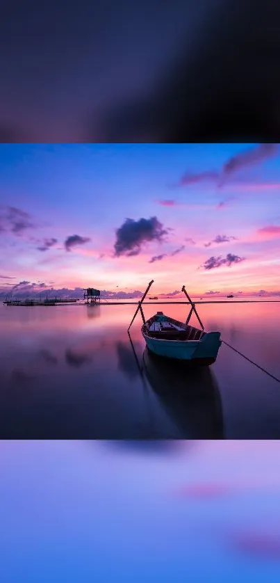 Tranquil sunset over water with a solitary boat, creating serene wallpaper.