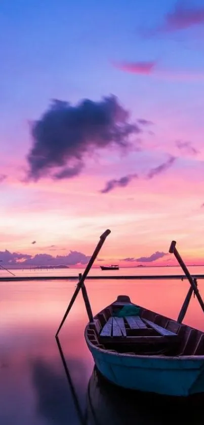 Serene boat at sunset with pink and purple sky.