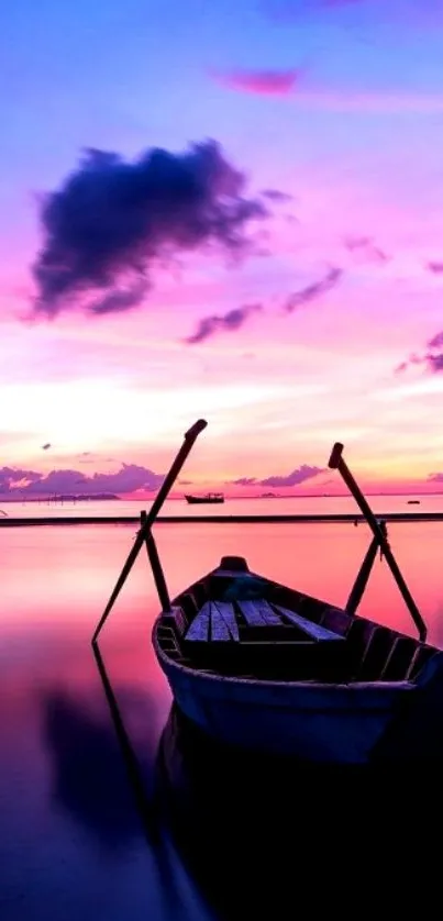 Serene sunset mobile wallpaper with a boat on calm waters.