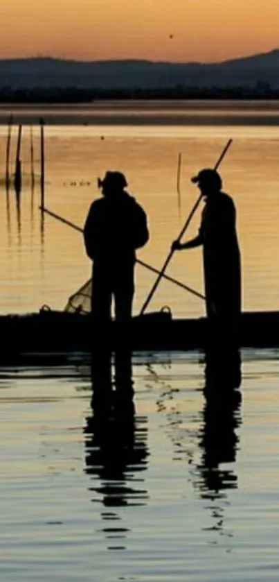 Two fishermen silhouetted against a sunset sky on a calm water surface.