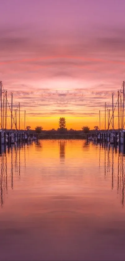 Serene harbor at sunset with boats reflected in calm water.