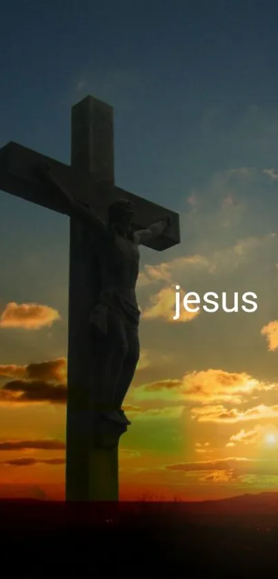 Silhouette of Jesus on cross against a sunset sky.