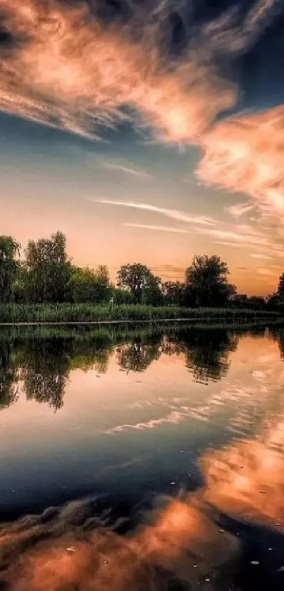 Serene sunset over a calm lake with reflections and a vibrant sky.