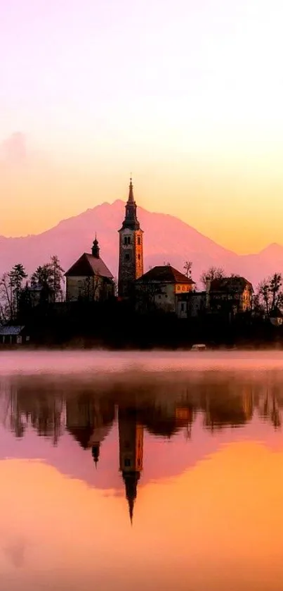 Scenic sunset over calm lake with church reflection.