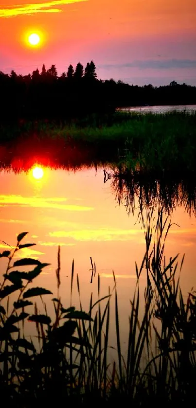 Peaceful sunset reflecting on calm lake waters with vibrant orange hues.