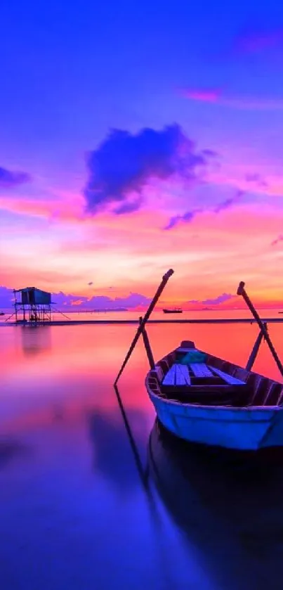 A boat gently floats on a calm lake at sunset with vivid blue and pink hues.