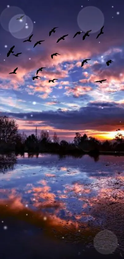 Serene sunset over a lake with birds in the sky creating a tranquil scene.