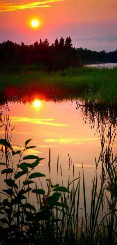 Serene sunset over a calm lake with vibrant reflections.